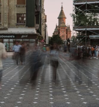 a blurry photo of people walking down a street